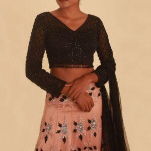 NUDE PINK LEHENGA WITH FLORAL DETAILS AND CONTRAST BLACK TASSELED CHOLI
