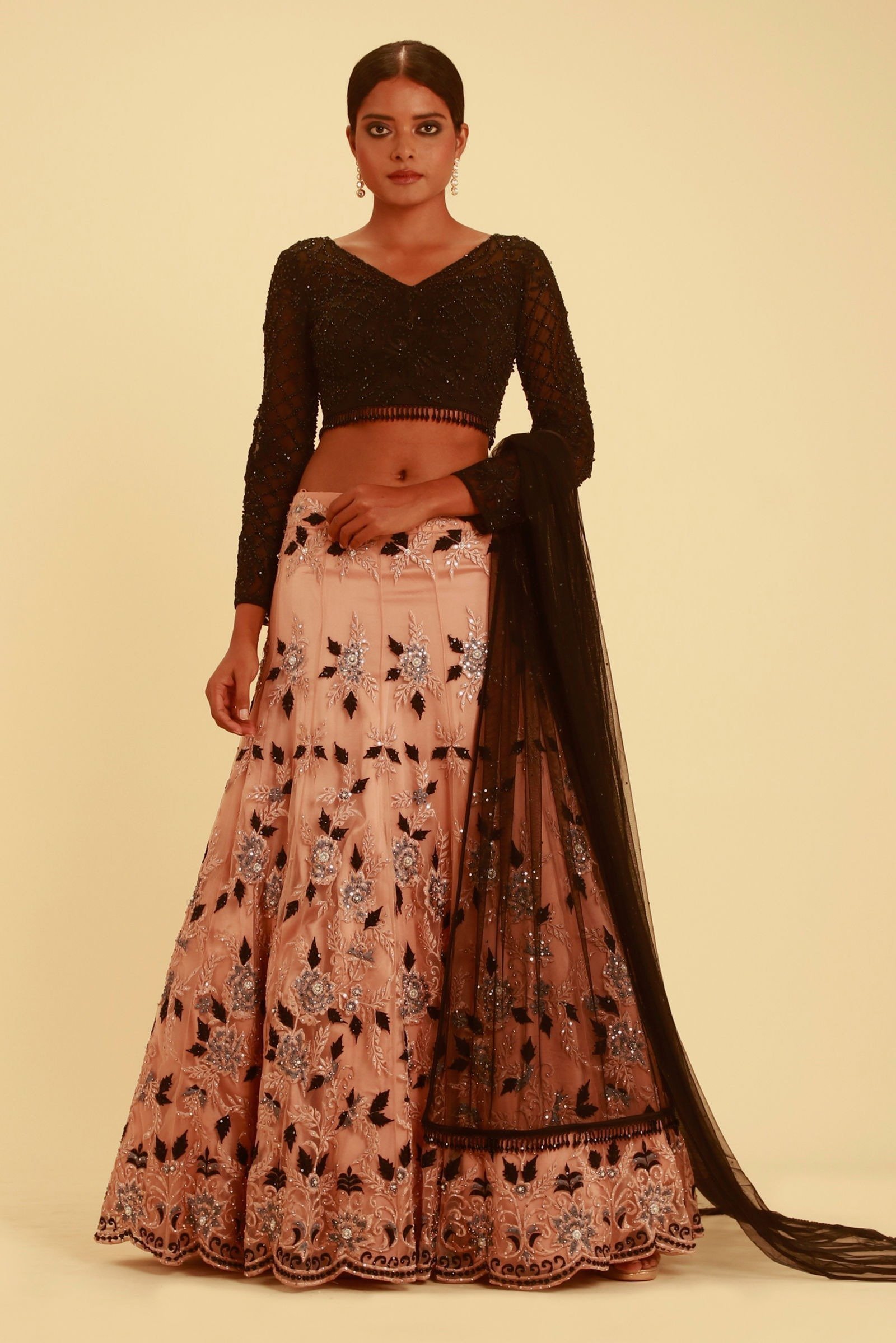 NUDE PINK LEHENGA WITH FLORAL DETAILS AND CONTRAST BLACK TASSELED CHOLI - Image 2
