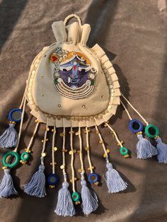 Handcrafted Traditional Potli Bag with Tassel Detailing